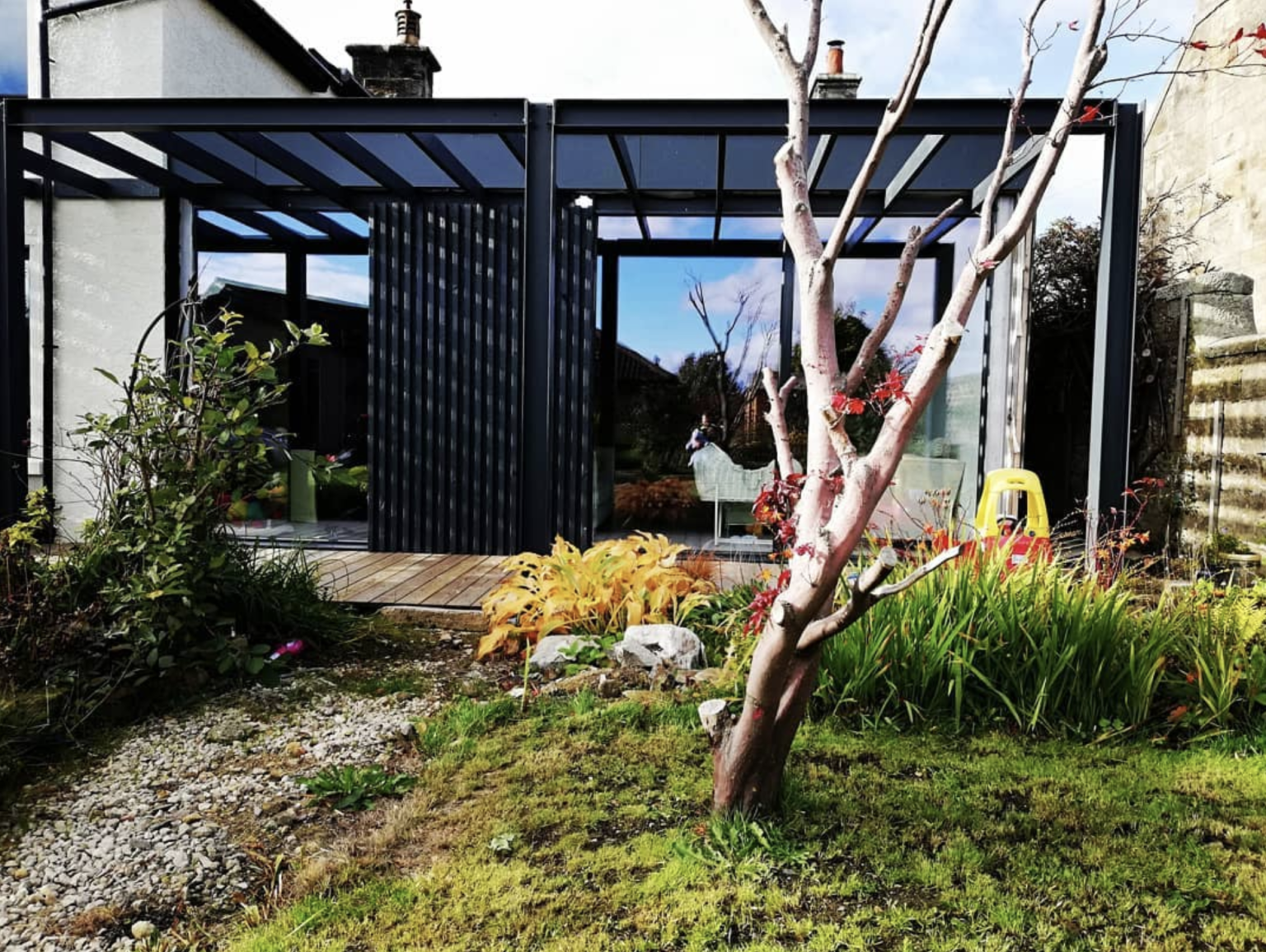 modern black timber and glass extension